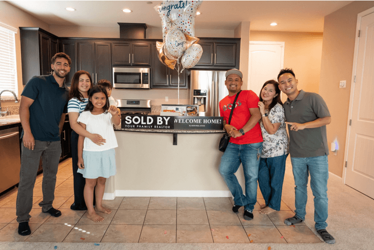 A family celebrating in their new kitchen