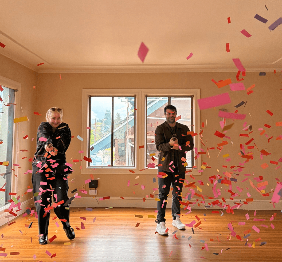 Jaden and a client celebrating a closing with confetti